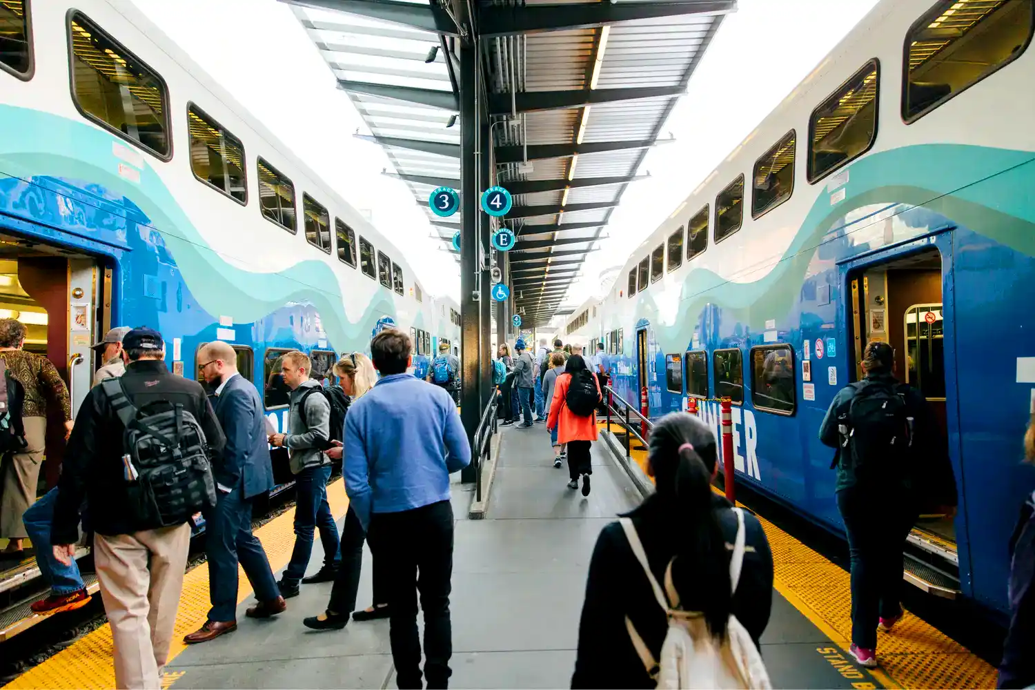 sounder train riders on a train platform boarding Sounder trains