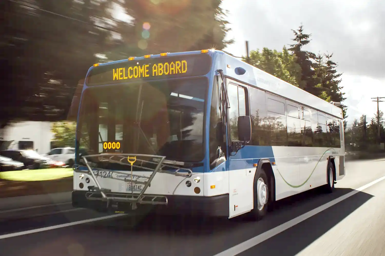Community Transit bus + light rail Community Transit local bus driving on a road