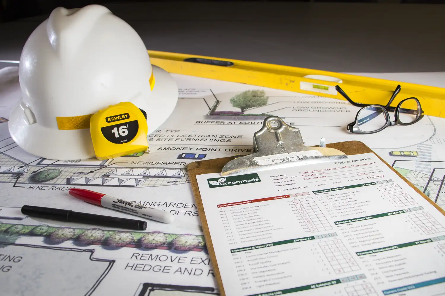 Construction hat and materials on a desk