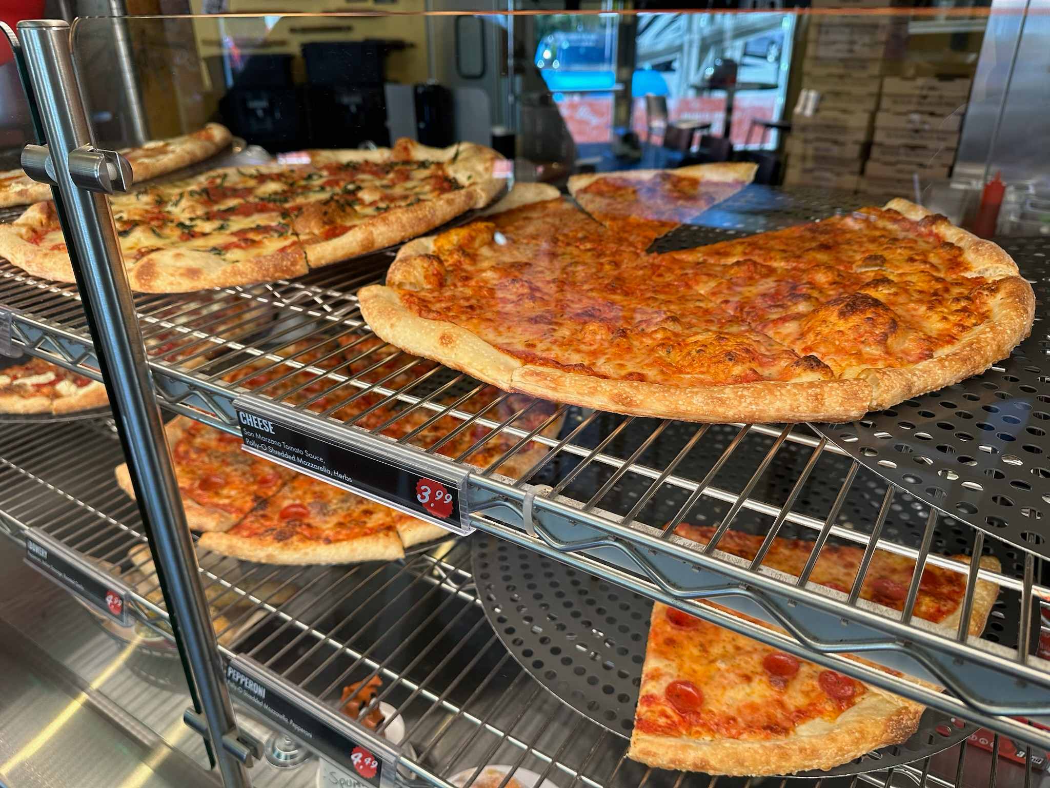Pizzas on display at Brooklyn Bros Pizzeria
