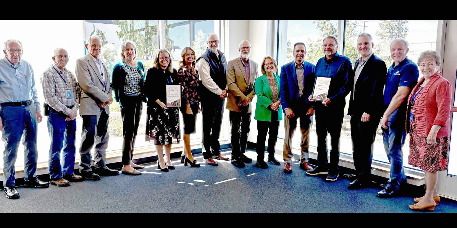 Group picture of Community Transit staff and board members with PSRC Executive Director after receiving the VISION 2050 Award on June 6 2024