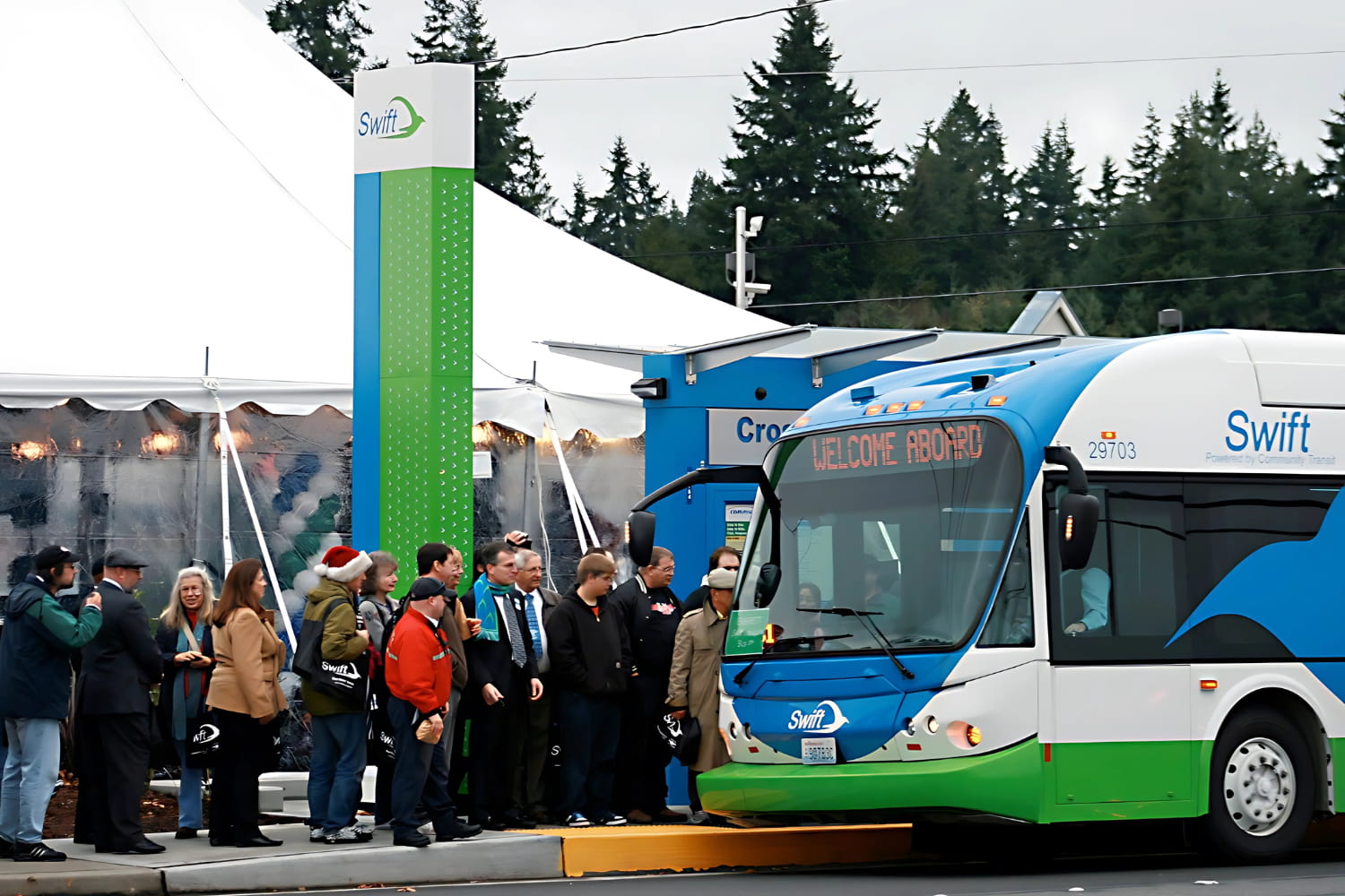 A crowd waits to be the first to board the first Community Transit Swift bus in 2009