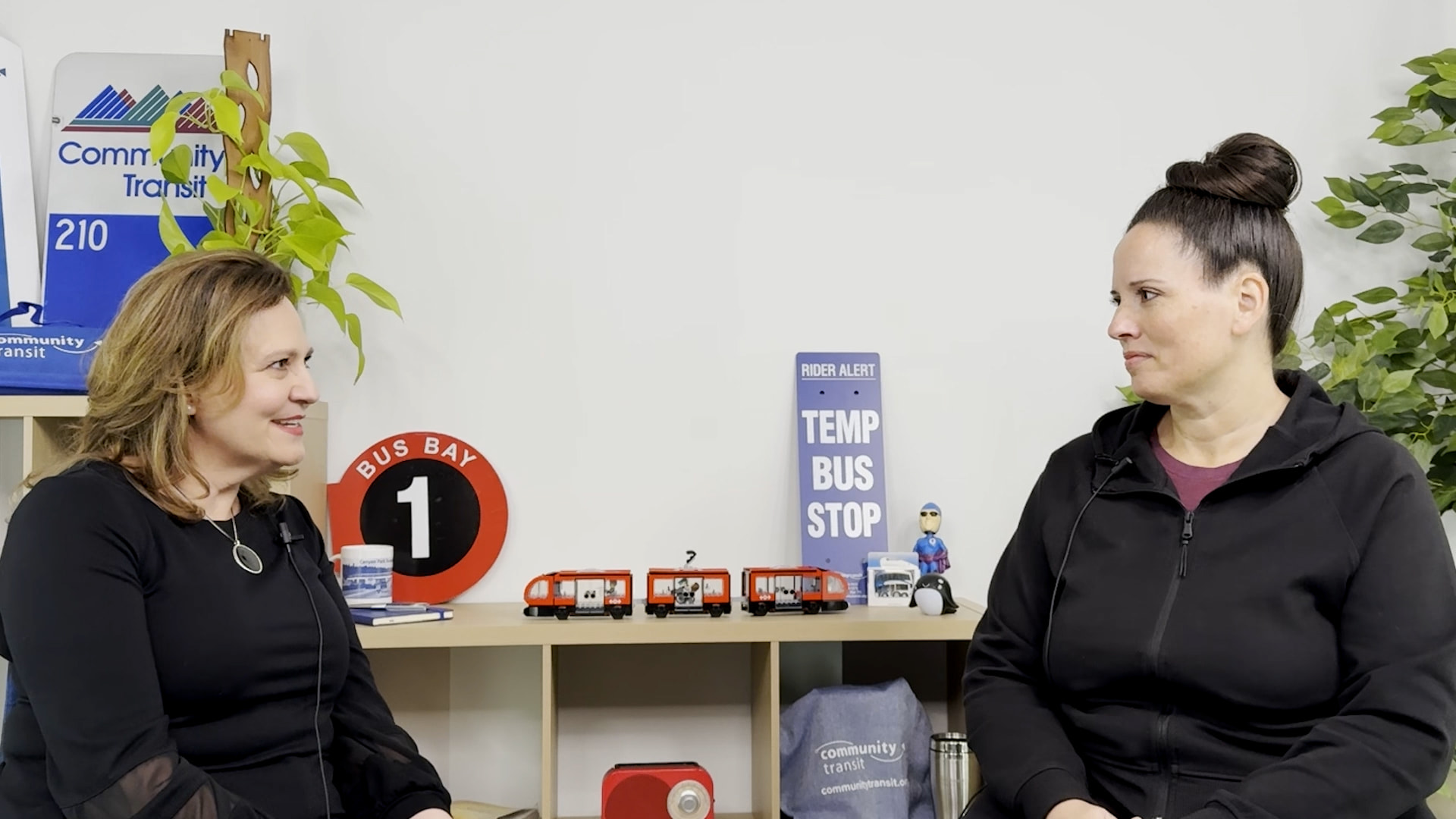 Two women talking in a studio setting