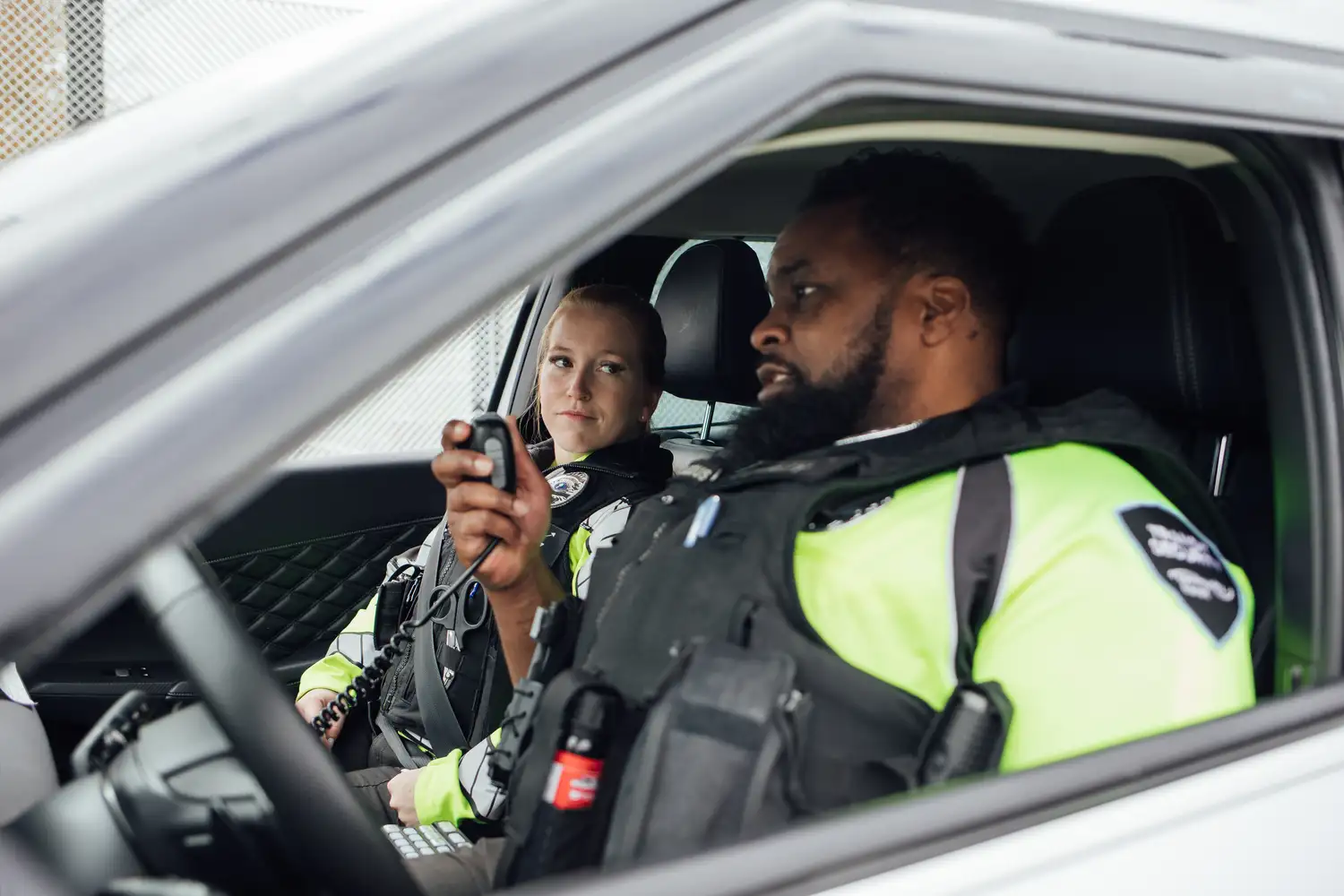 Transit Security Officers in patrol car