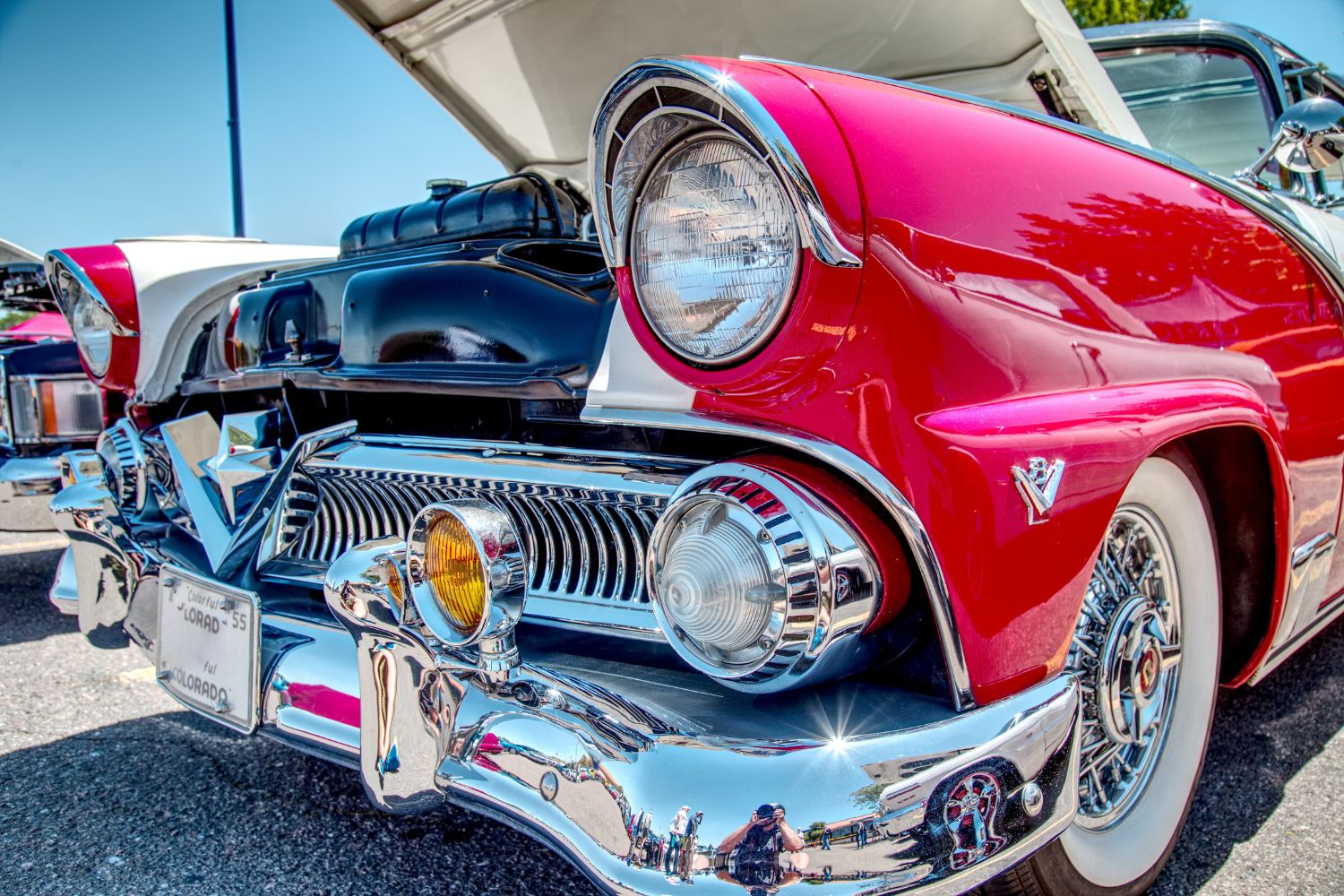 A shiny, bright red vintage car.