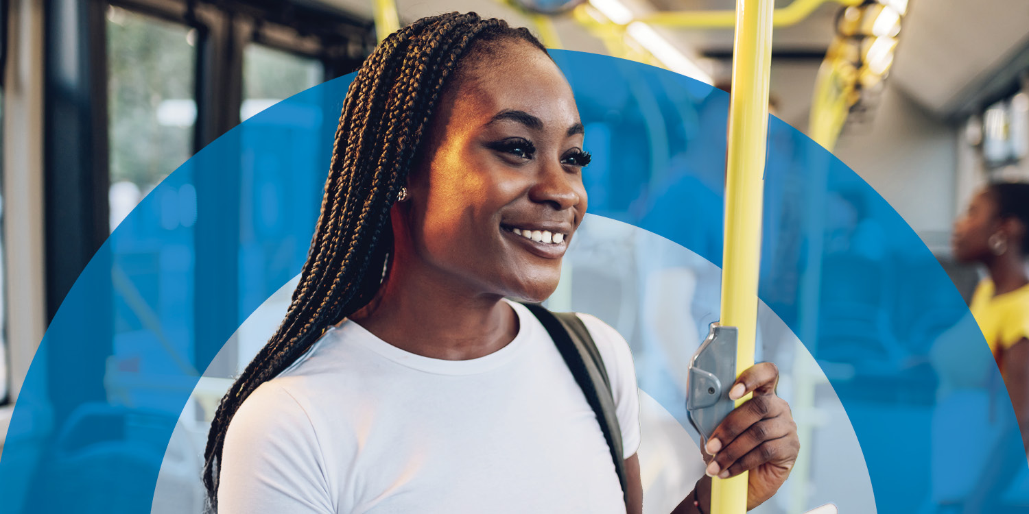 Smiling young woman on bus