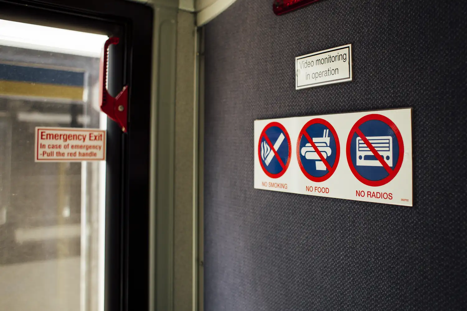 a photo of rider rules posted inside a bus