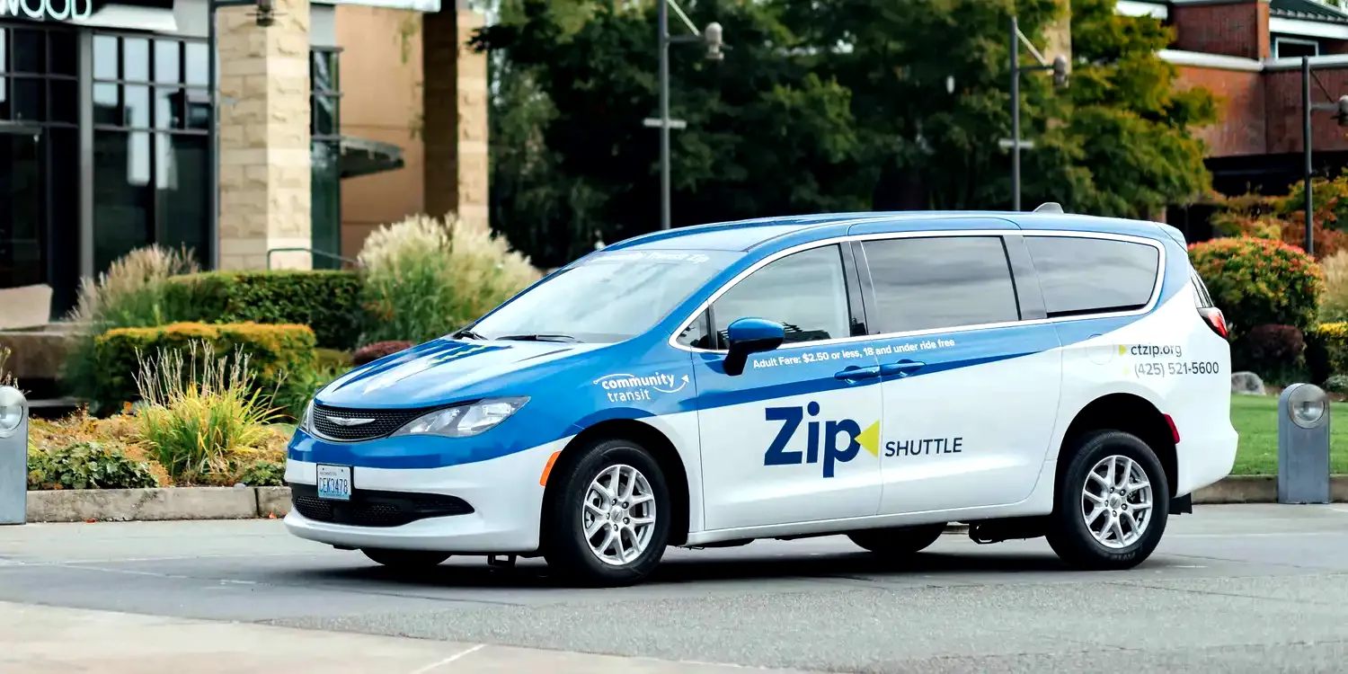 a Zip shuttle van parked waiting for passengers